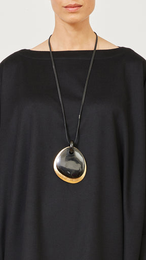 two part elliptical black and gold pendant