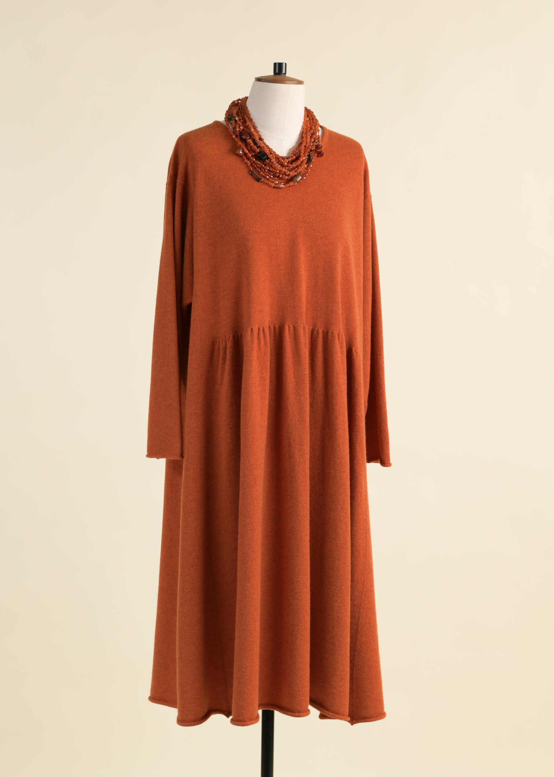 cashmere a-line bateau neck knit dress with pleated panels