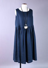 linen sleeveless round neck dress with full pleated skirt