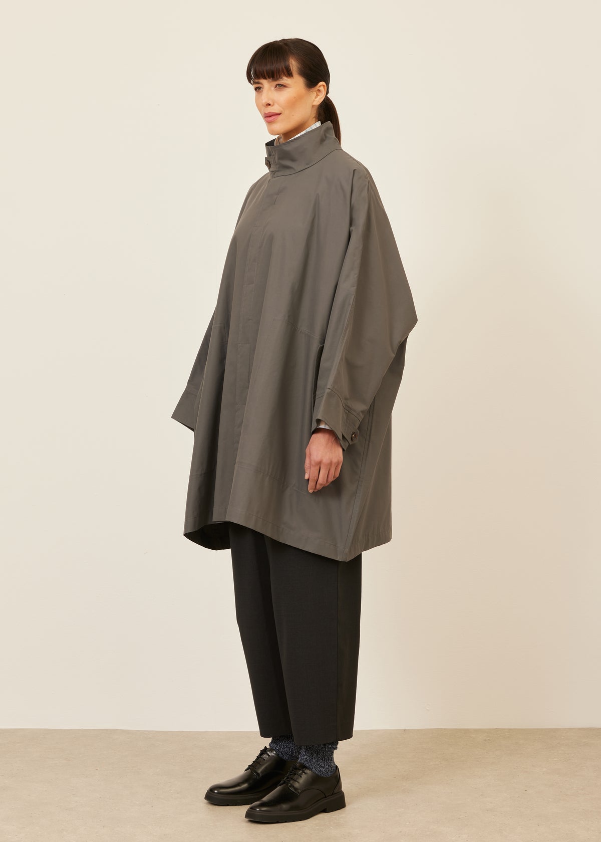 extra wide sloped shoulder raincoat with tabs - very long
